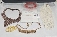 All six jewelry pieces arranged on surface