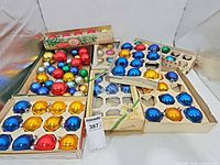 Group shot of all ornament boxes and loose ornaments