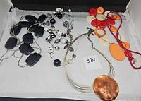 Overview of four necklaces in lot