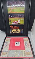 Overall lot showing framed photos, two 1980 World Series Game 7 tickets and partial 2008 Division Series ticket