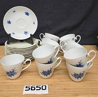 Group view of cups and saucers showing pattern and approximate counts