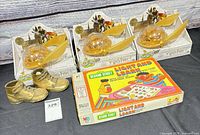 Lot overview showing three Harry Potter Perplexus boxes, Sesame Street Game box, toddler boots