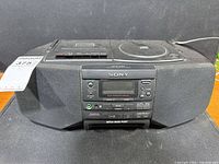 Front view of Sony boombox showing CD player, cassette deck, controls and speakers
