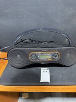 Front view of Sony PSYC boombox showing speakers, controls and display