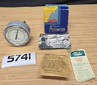 Altimeter, box, instruction sheet, tag, paper insert overview
