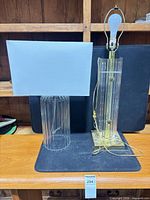 Both Lucite lamps side by side showing overall design and size comparison