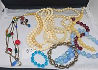 All items laid out showing variety of necklaces and bracelets