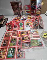 Multiple binder pages of red-border Return to Oz and cat stickers plus empty display boxes