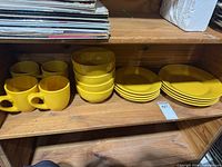 Set on shelf showing mugs, bowls and plates