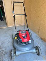 Full front view of Craftsman push lawn mower showing handle, deck, wheels
