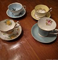 All four bone china teacup and saucer sets