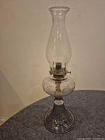 Full view of vintage glass oil lamp with chimney