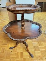 Full view of two-tier wooden occasional table showing overall design and condition
