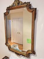 Full view of ornate gilded wall mirror