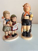 Front view of both Hummel figurines