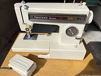 Full view of Kenmore sewing machine with foot pedal