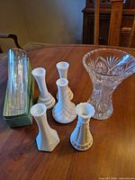Group shot of all seven vases on table