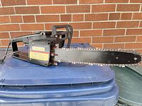 Full view of Mastercraft corded chainsaw showing 18-inch bar and chain