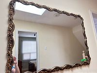 full view of mirror on wall showing frame outline and proportions