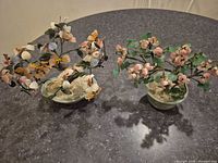 Both bonsai sculptures side by side showing overall design and size relation