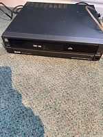 Front and top view of Sears VHS VCR showing overall unit and attached power cord