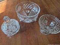 Group shot of the three clear cut glass items on table