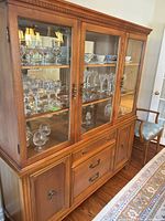 Full view of china cabinet showing glass upper and wood lower