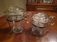 Both percolators side by side on table