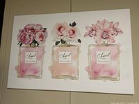 Full view of canvas showing trio of floral perfume bottle illustrations