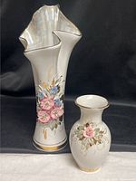 Both Kislovodsk porcelain vases side by side showing size difference and floral design