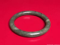 Top view of solid green jade round bangle bracelet