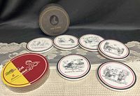 Full lot: six ceramic The New Yorker coasters laid out, storage box, and separate stack of Mom’s Dinner coasters