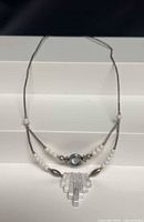 Full view of bib necklace showing overall length and design