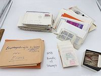 Overall view of lot showing stacks of covers, glassine envelopes, manila envelope, small box