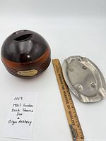 Tobacco jar and ashtray with ruler for scale