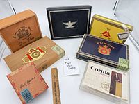 Group shot of all seven cigar boxes