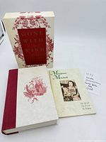 Slipcase, hardcover book, and companion booklet laid out together