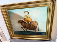 Front view of gold frame with painting