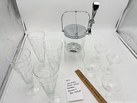 All items grouped: 4 pilsners, 2 martinis, 2 champagne coupes, ice bucket with stand and tongs