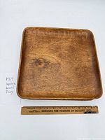 Full view of square wood tray with ruler for scale