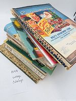 Stack of vintage catalogs showing varied covers