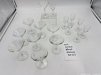 Full set of 16 etched wheat glasses laid out