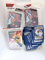 Front view of sealed mini portfolios and loose cards