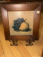 Front view of framed still life print showing pear and grapes