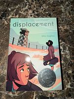 Front cover of graphic novel showing title, author, cover art, award sticker