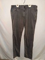 Full front view of gray Faherty jeans hanging