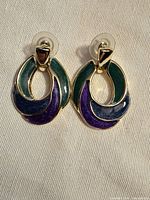 Front view of enamel earrings showing colors and design