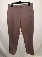 Front view of Gap khaki pants hanging