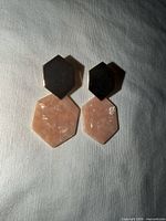 Front view of both earrings showing gold-tone hexagon tops and pink stone dangles