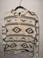 Full front view of hoodie on hanger